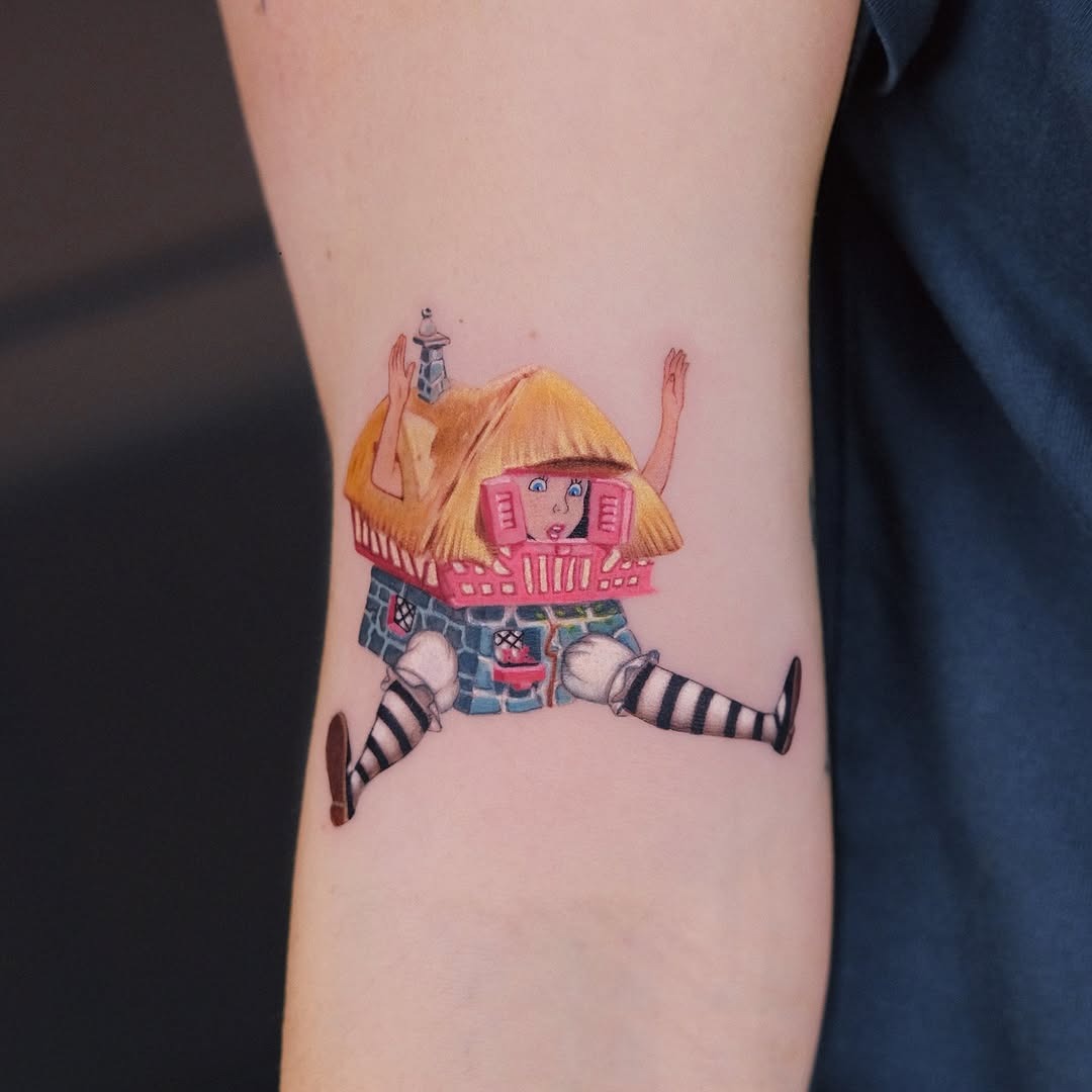 This tattoo features a quirky Disney princess in a unique style, combining elements of fun and nostalgia.