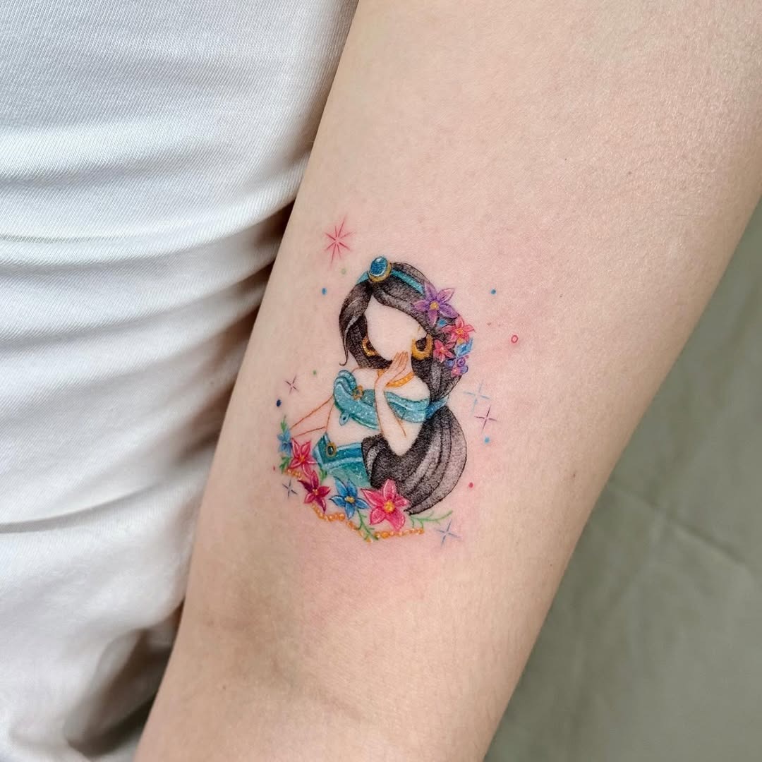 This enchanting tattoo features a Disney princess surrounded by flowers.