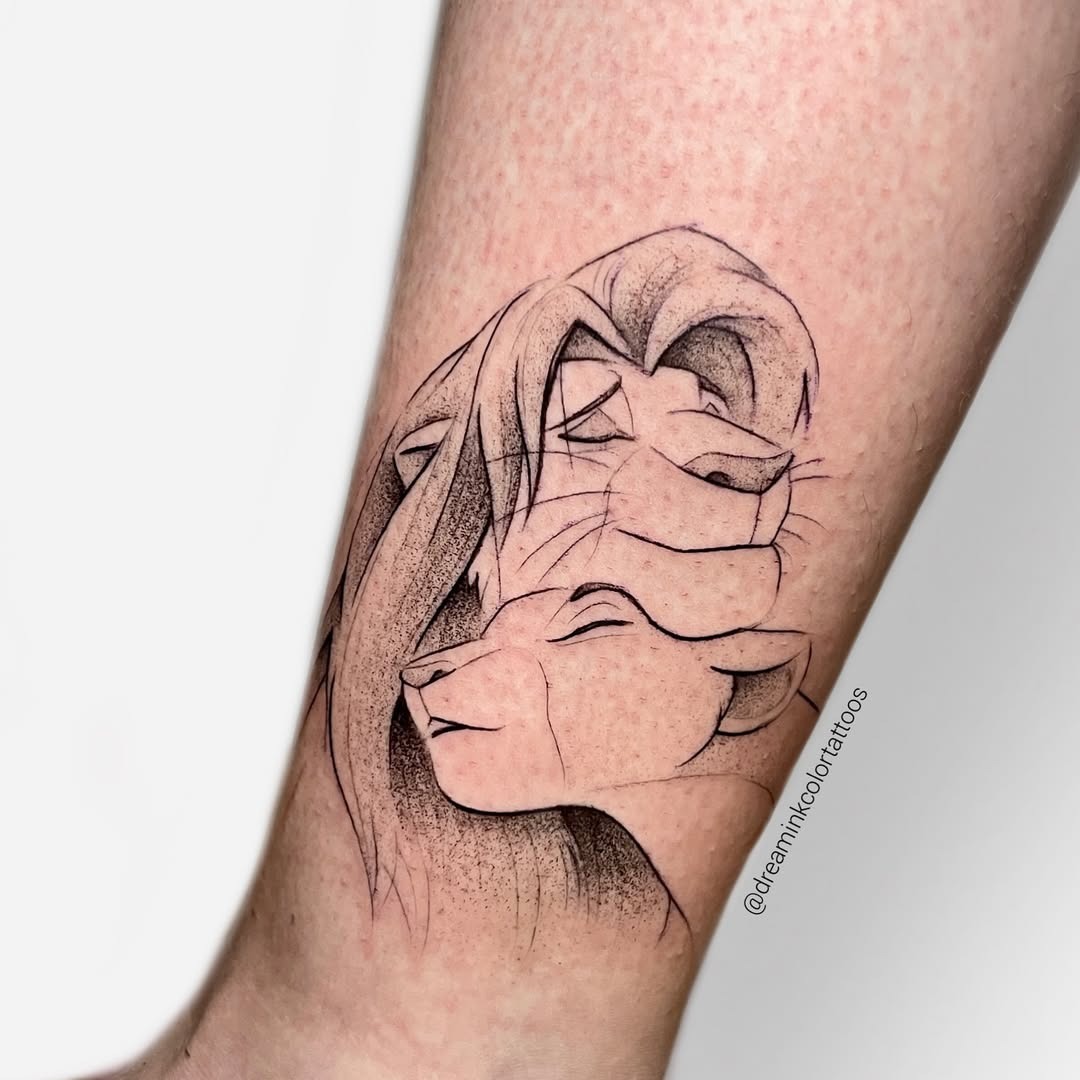 This tattoo showcases a beautifully simple line art of Simba and Nala, capturing a tender moment between the beloved characters.