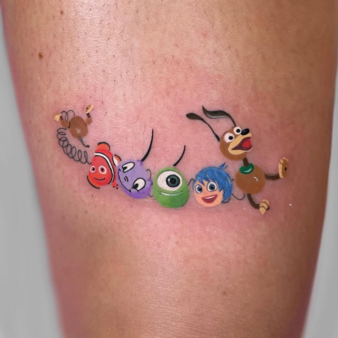 This tattoo features beloved Disney characters, capturing a sense of joy and nostalgia.