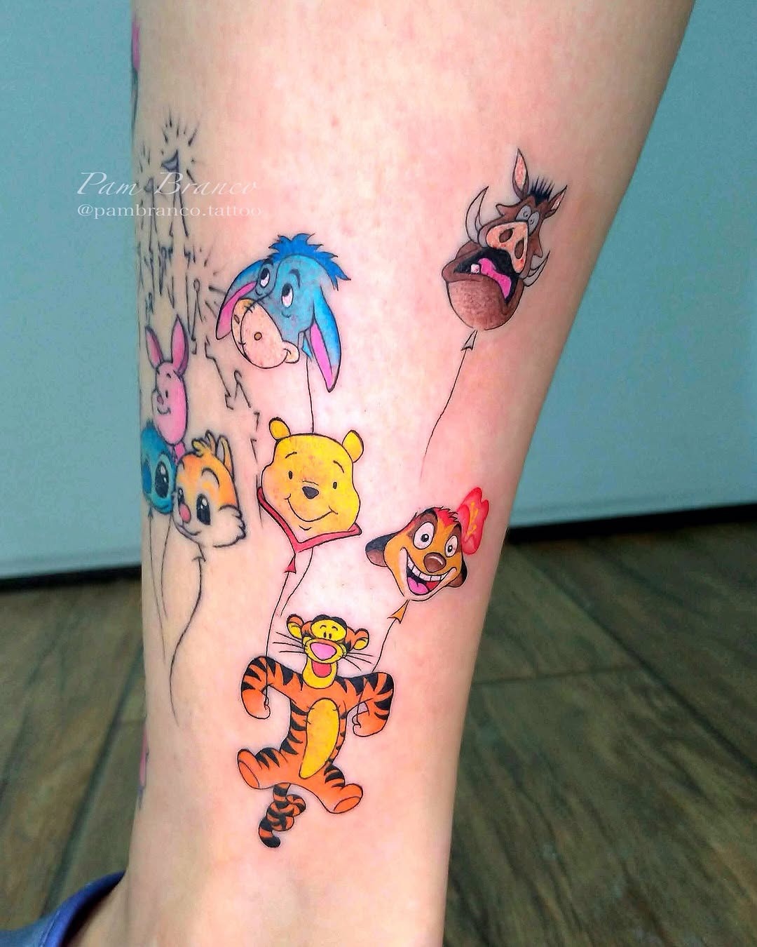 This tattoo features beloved Disney characters like Tigger, Winnie the Pooh, and Eeyore.