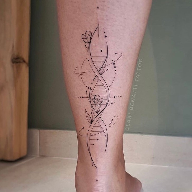 This tattoo features a sleek and modern depiction of DNA, intertwined with delicate floral elements.