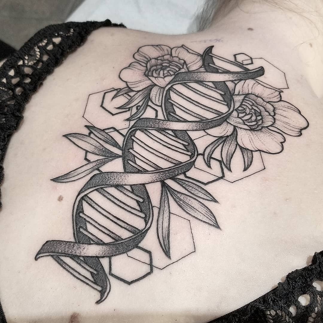 This tattoo features a striking representation of a DNA helix intertwined with beautiful peony flowers, set against a geometric background.