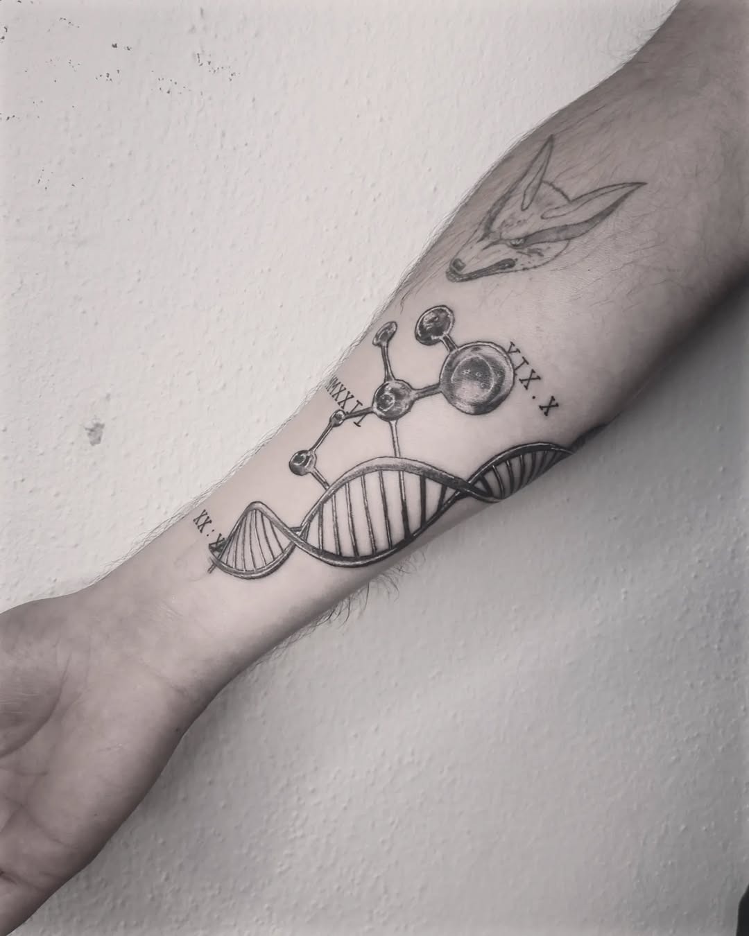 This intricate DNA tattoo features a double helix design intertwined with molecular structures.