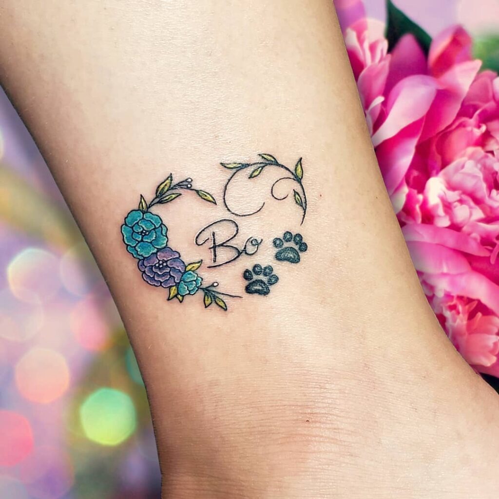 Angelic Paw Print with Wings and Name Tattoo Tattoo Design