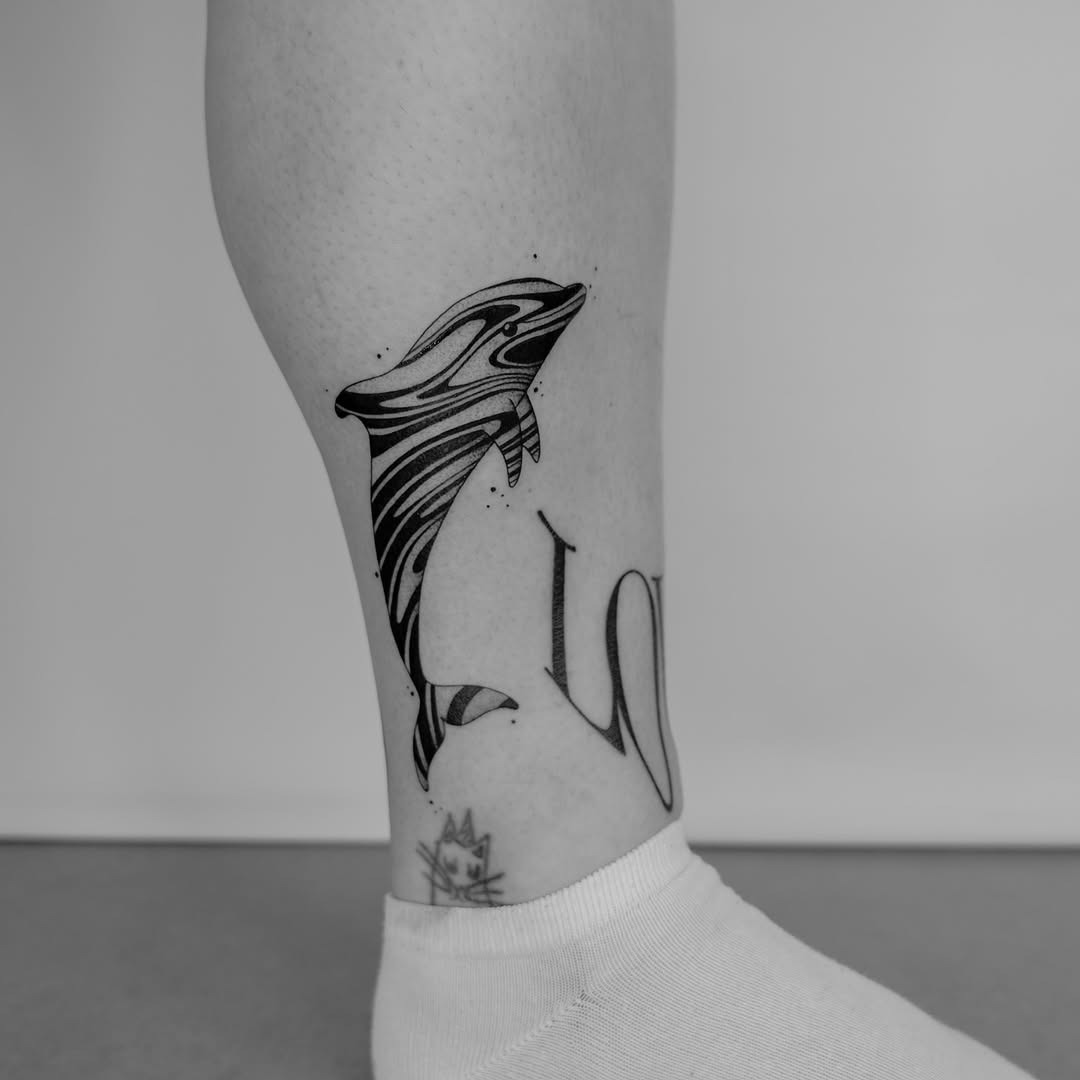 Captivating dolphins in playful motion tattoo Tattoo Design