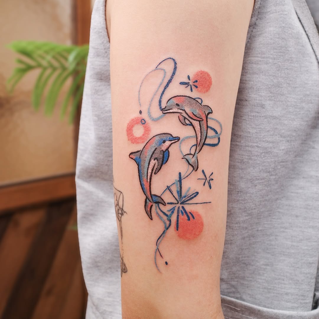 Charming dolphin tattoo with winter vibes Tattoo Design