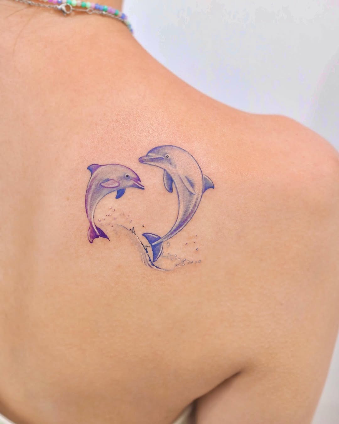 Colorful dolphin tattoo showcasing playful elegance Tattoo Design