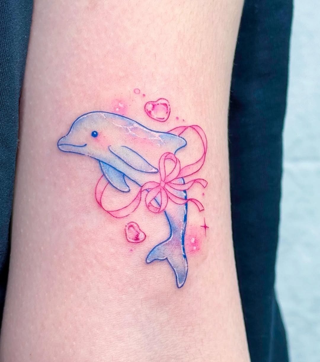 Colorful dolphin tattoo surrounded by playful bubbles Tattoo Design