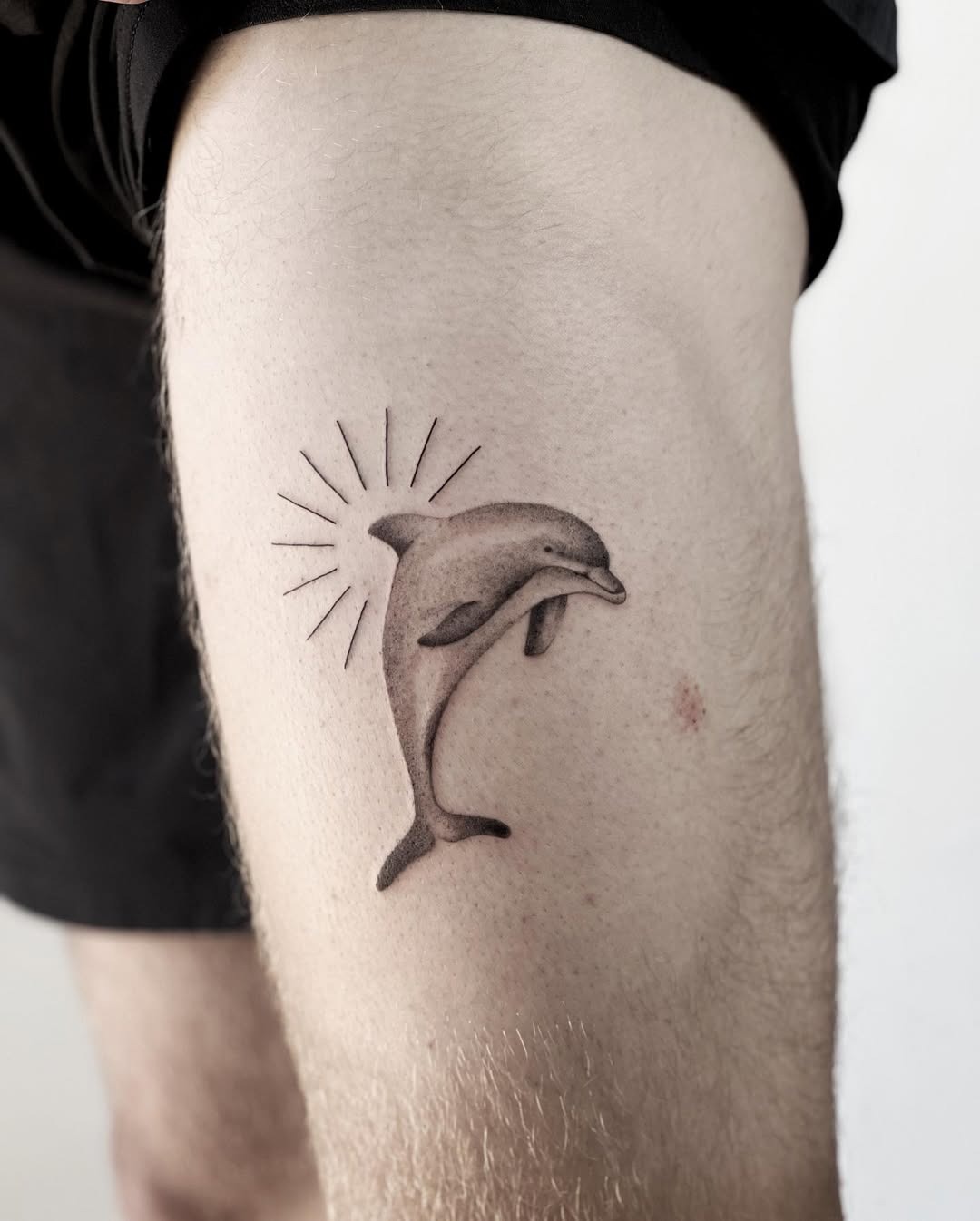 Minimalist Dolphin Tattoo on Shoulder Tattoo Design