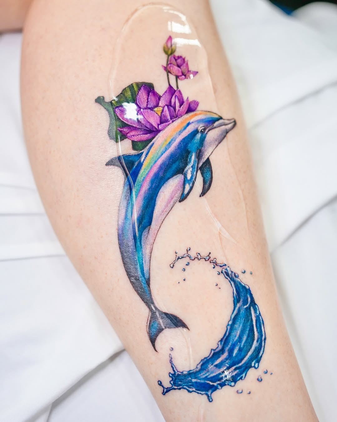 Minimalist Dolphin Tattoo on the Wrist Tattoo Design