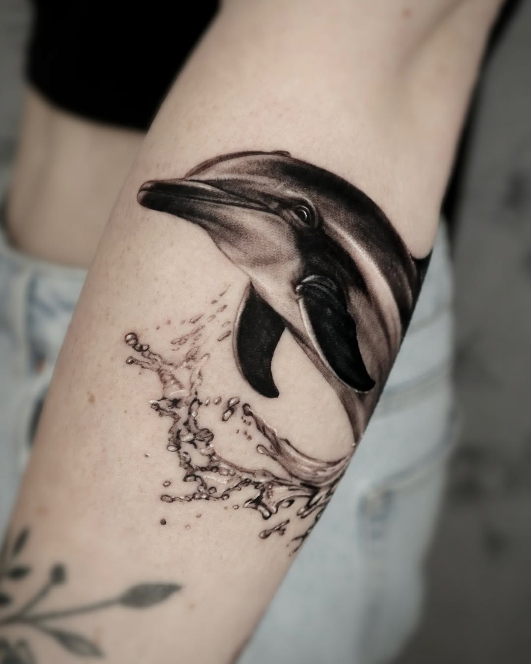 Playful dolphin tattoo with rainbow and stars Tattoo Design