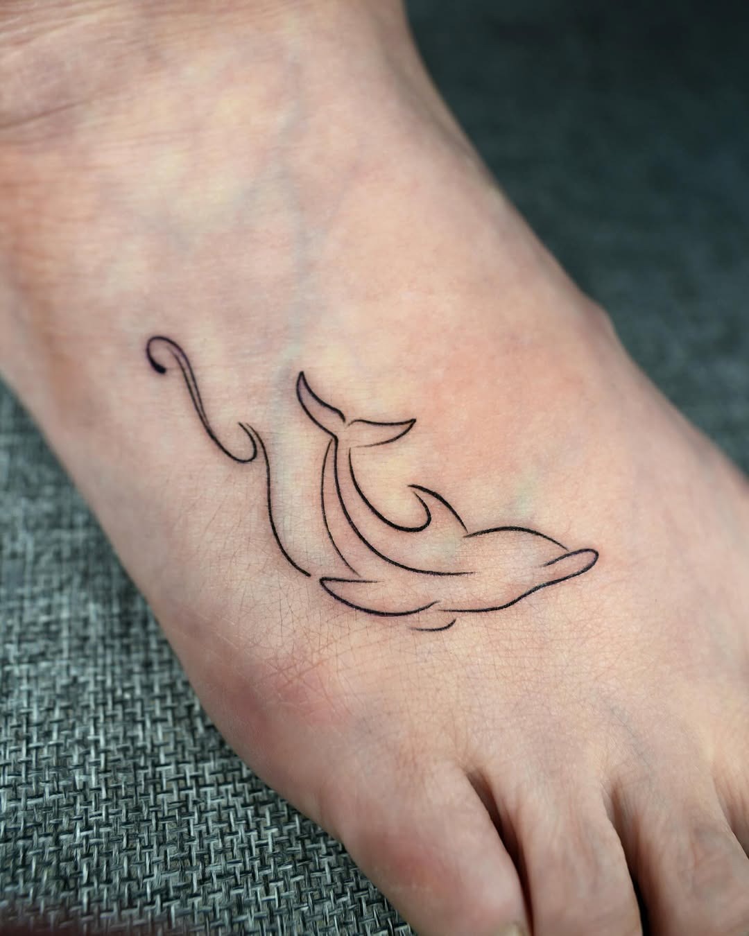 Realistic dolphin tattoo with bubbles Tattoo Design