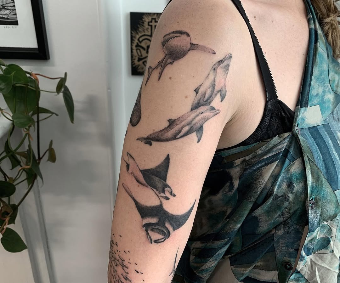 Stunning Dolphin Tattoo with Artistic Elements Tattoo Design