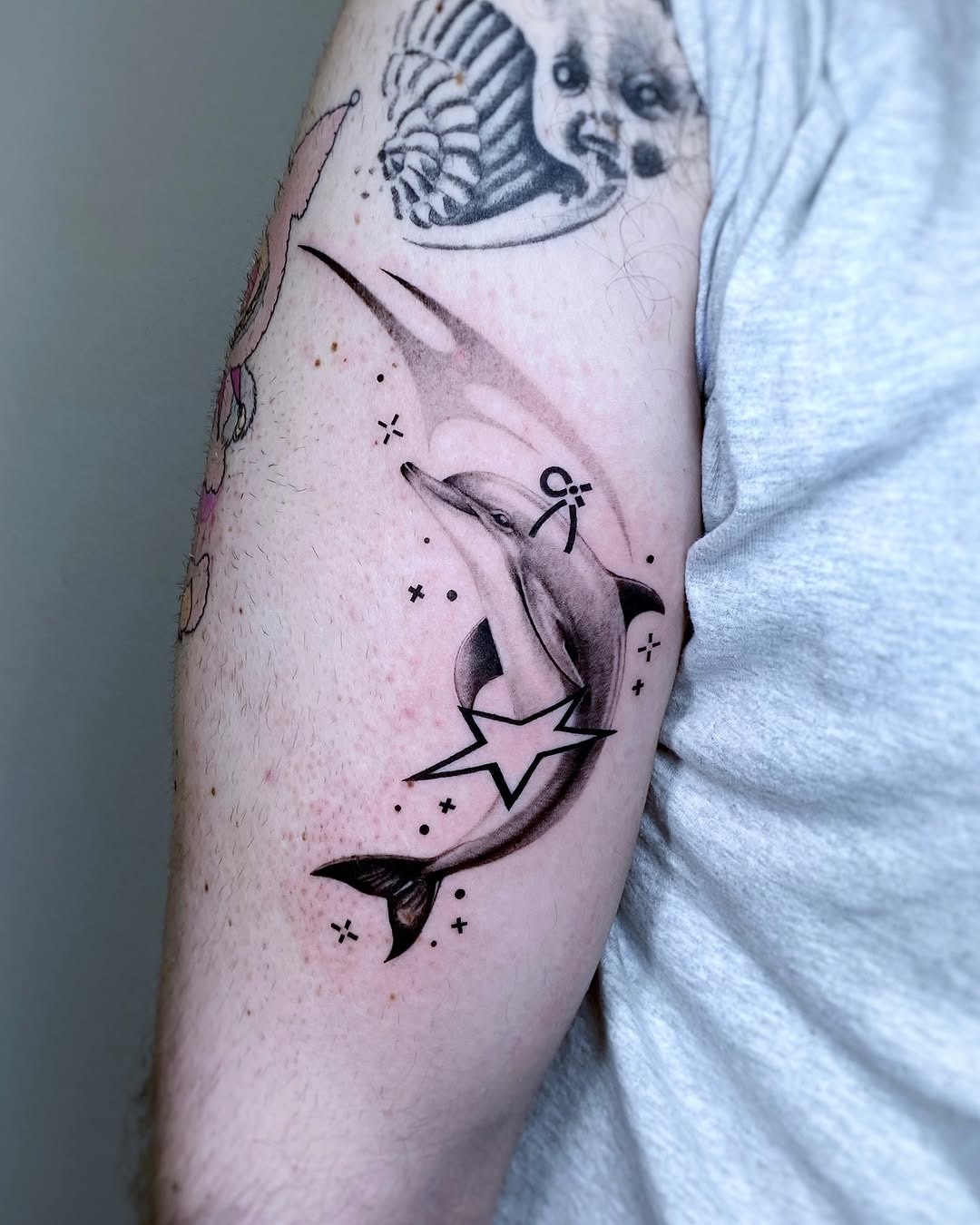Stunning dolphin tattoo with galaxy vibes Tattoo Design