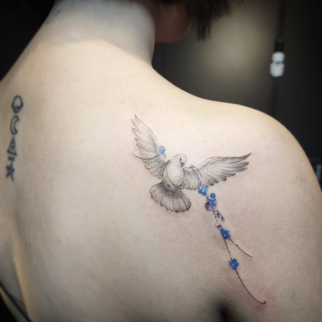 Elegant dove tattoo symbolizing peace and freedom Tattoo Design
