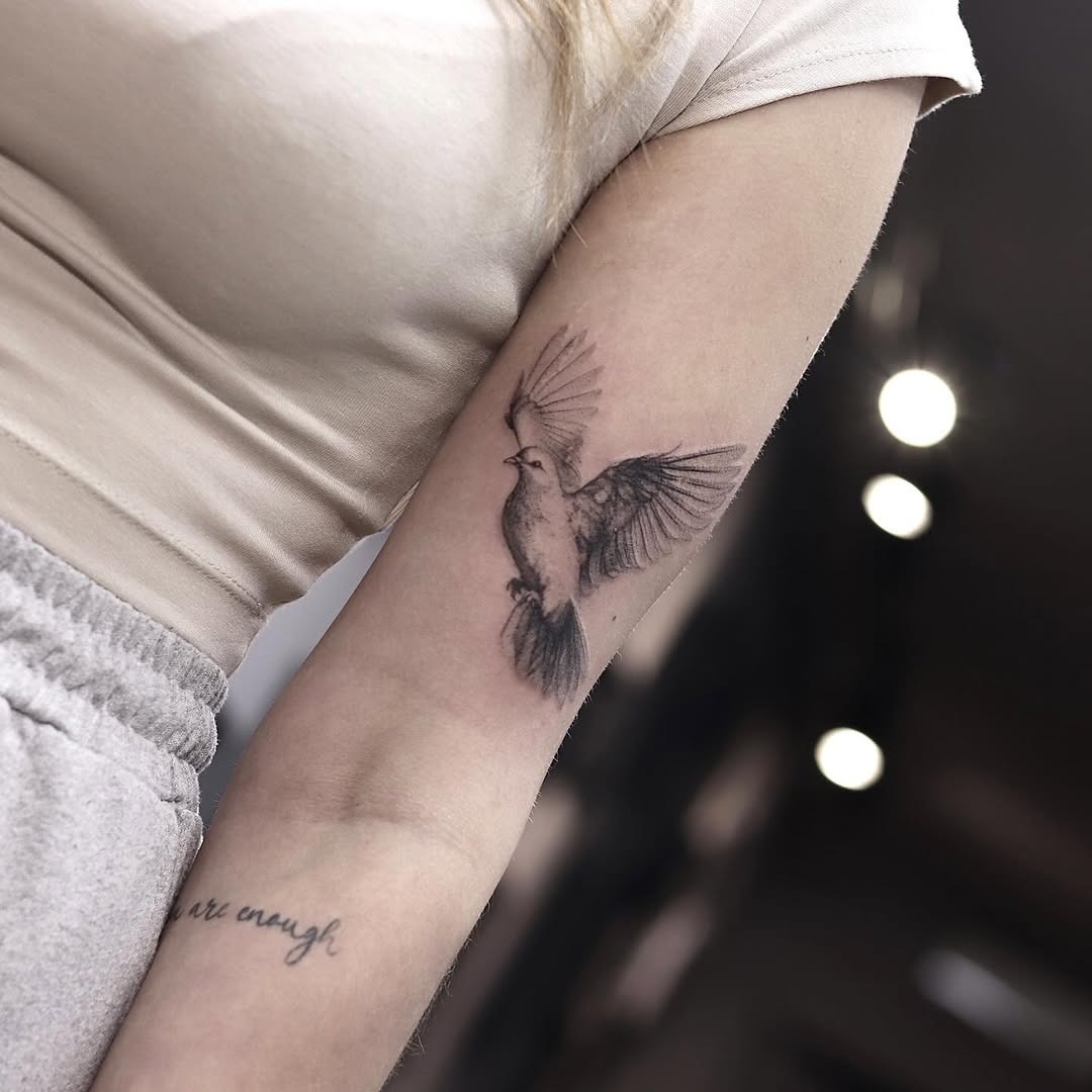 Elegant dove tattoo symbolizing peace and freedom Tattoo Design