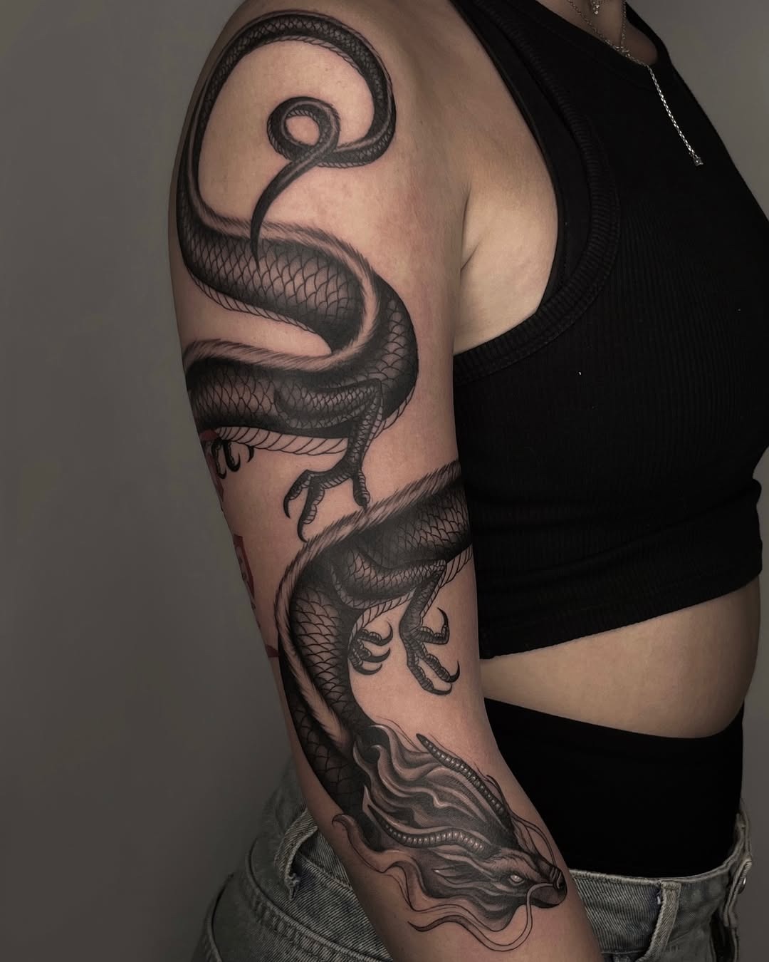 A striking dragon tattoo in intricate detail Tattoo Design