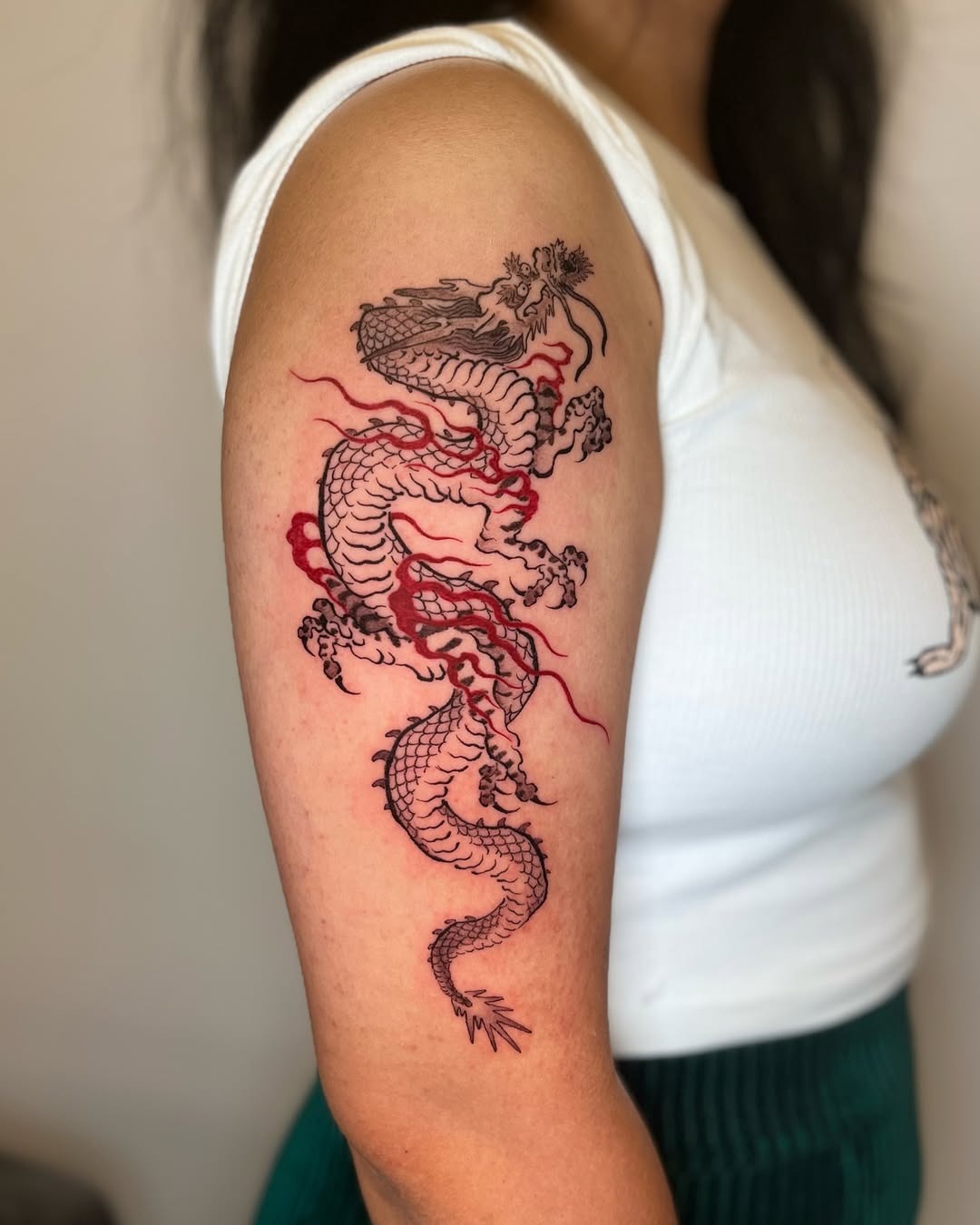 Bold Red Dragon Tattoo on Upper Arm Tattoo Design