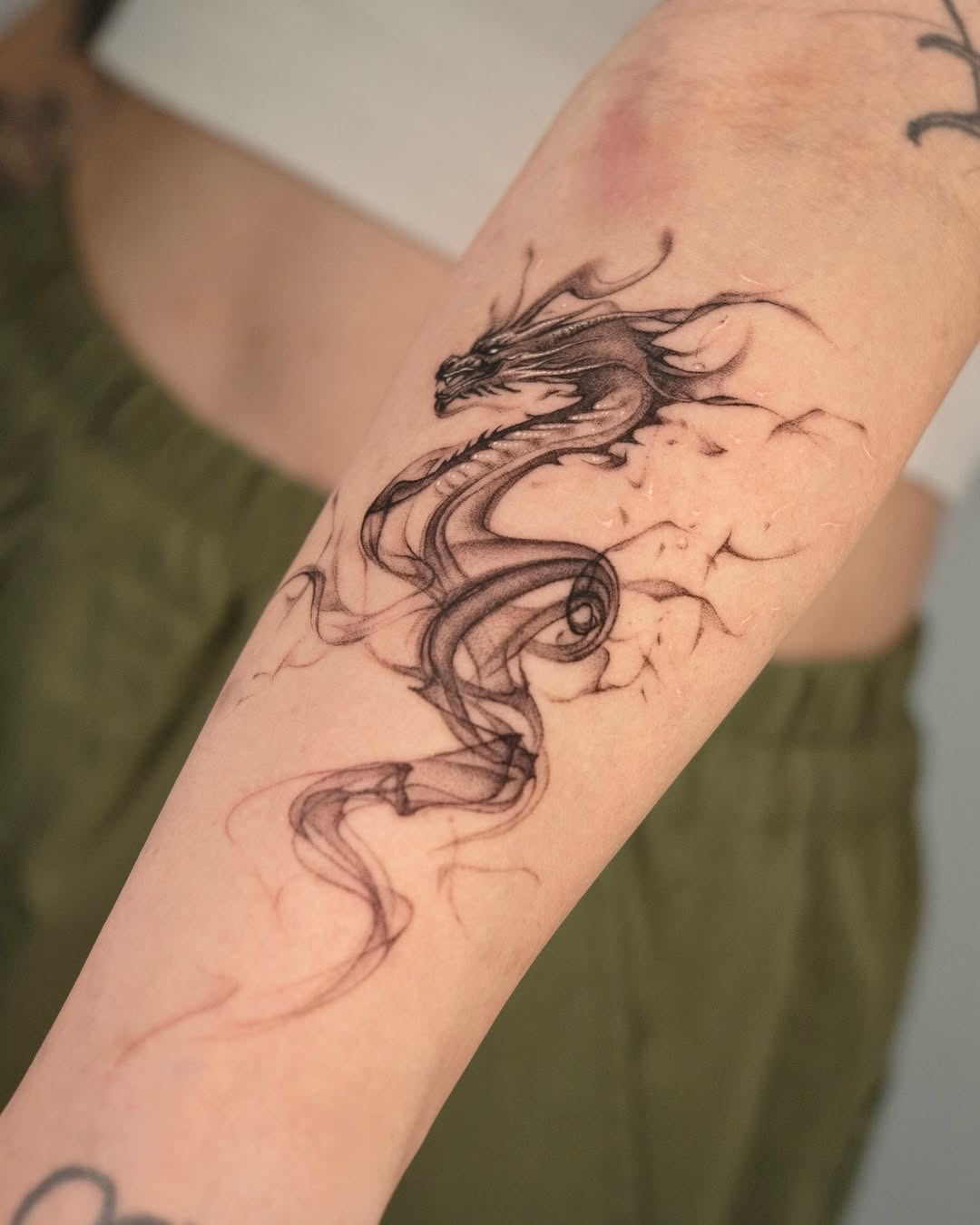 Elegant black dragon tattoo on forearm Tattoo Design