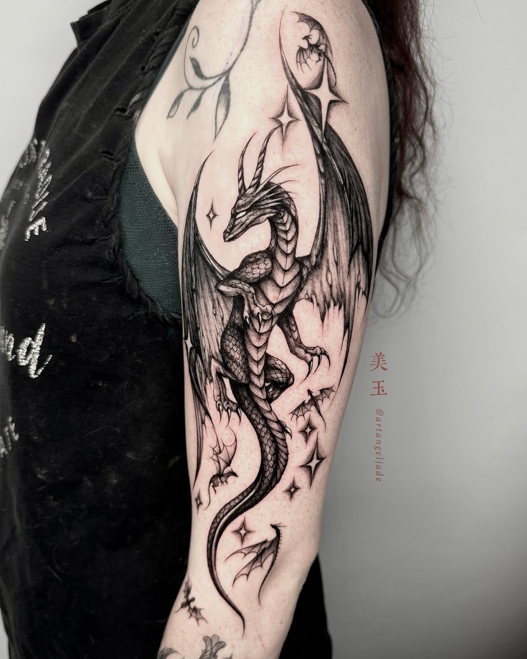 Intricate dragon tattoo with celestial elements Tattoo Design