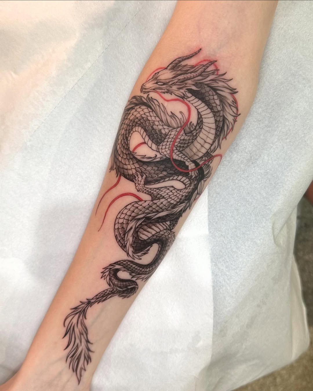 Intricate Dragon Tattoo with Flowing Details Tattoo Design