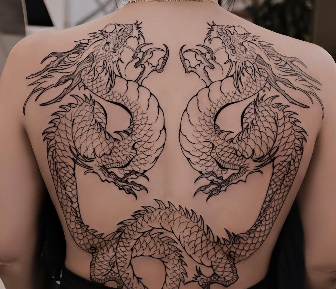 Intricate twin dragons embracing on back Tattoo Design