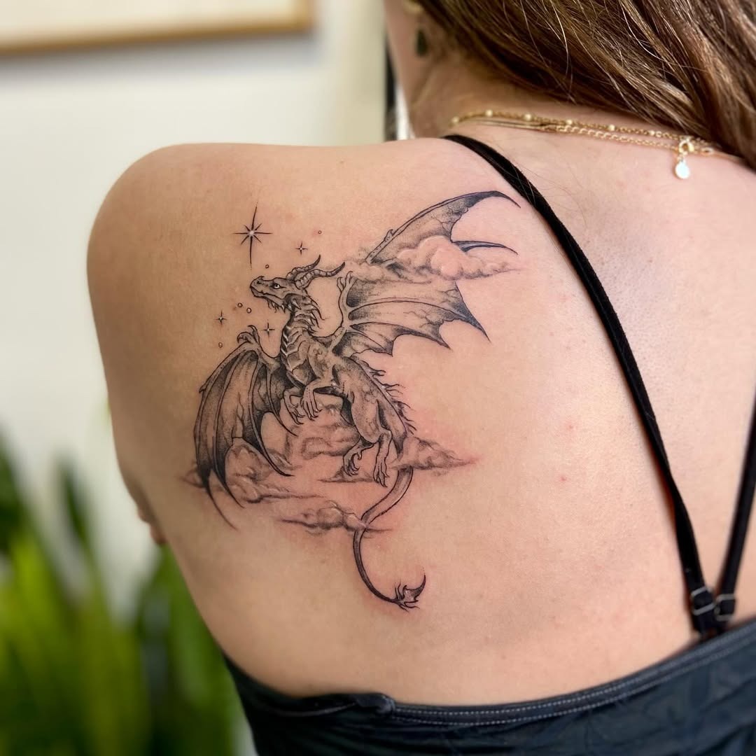 Majestic dragon tattoo soaring through clouds Tattoo Design