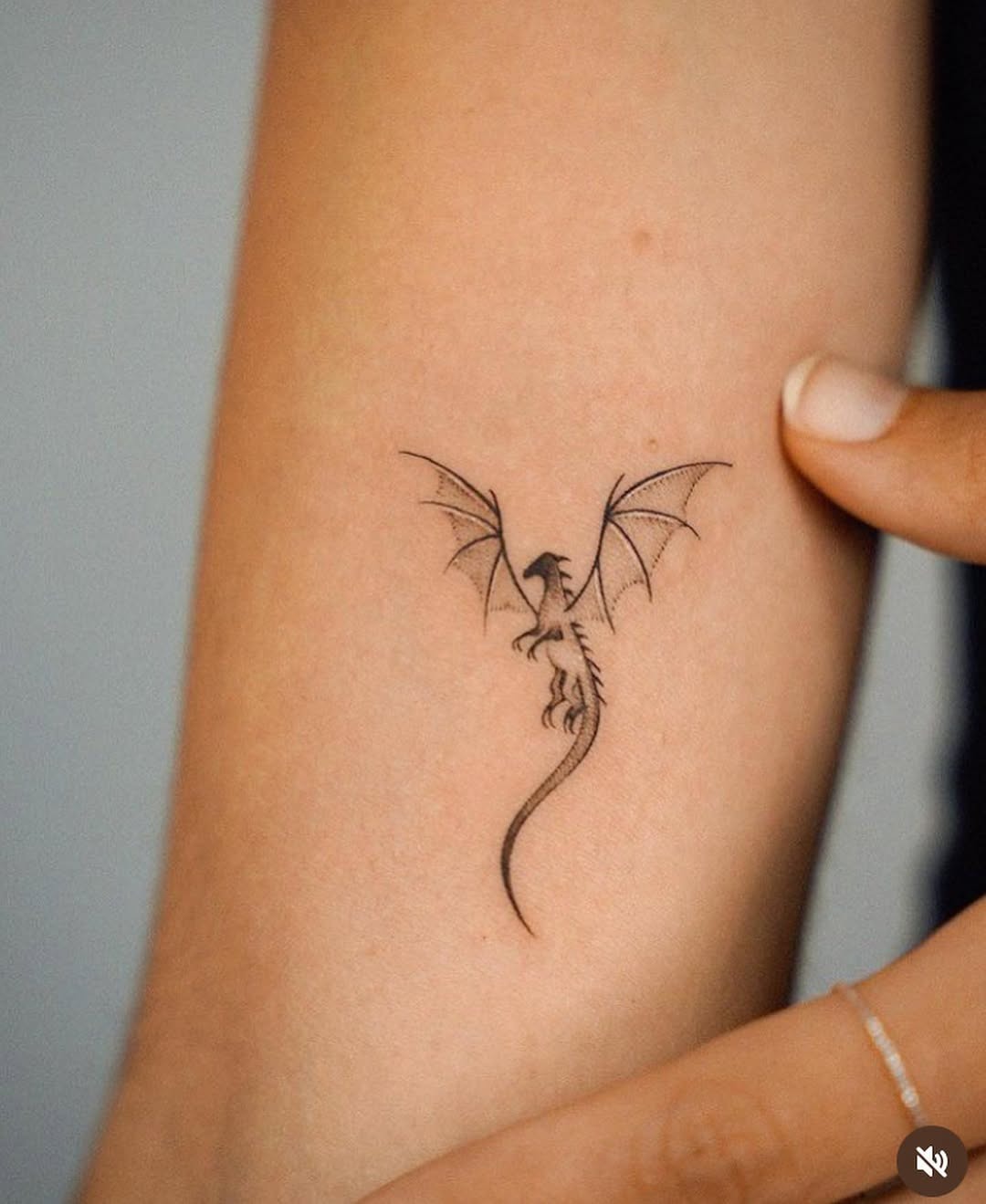 Minimalistic Dragon Tattoo with Delicate Wings Tattoo Design