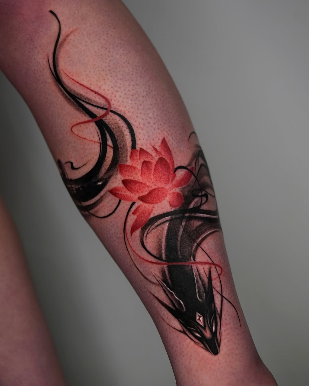 Striking Dragon Tattoo with Lotus Flower Design Tattoo Design