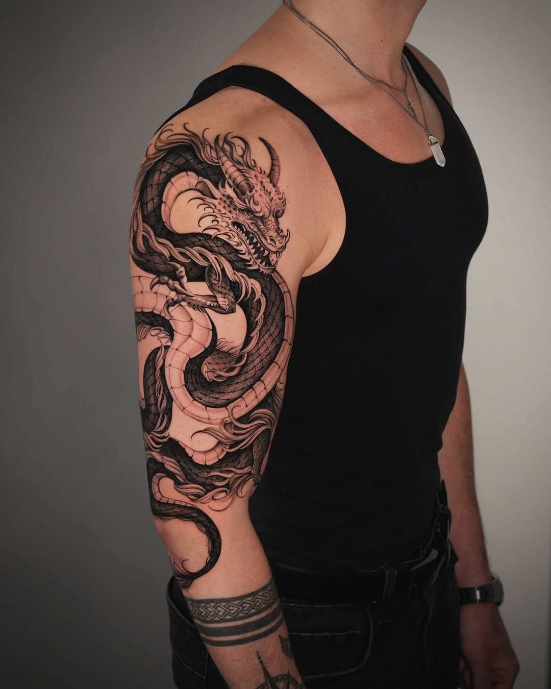 Striking Dragon Tattoo Wrapping Around Arm Tattoo Design