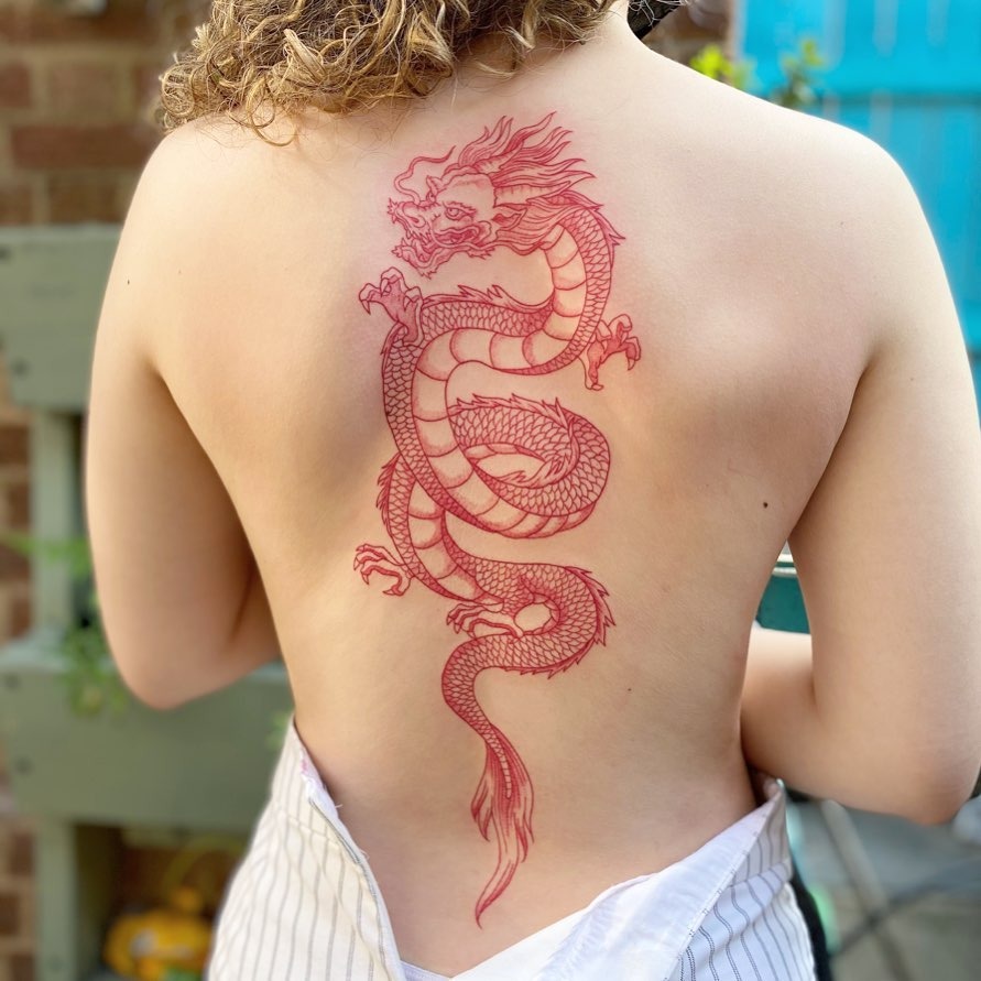 Stunning dragon tattoo in vibrant red ink Tattoo Design