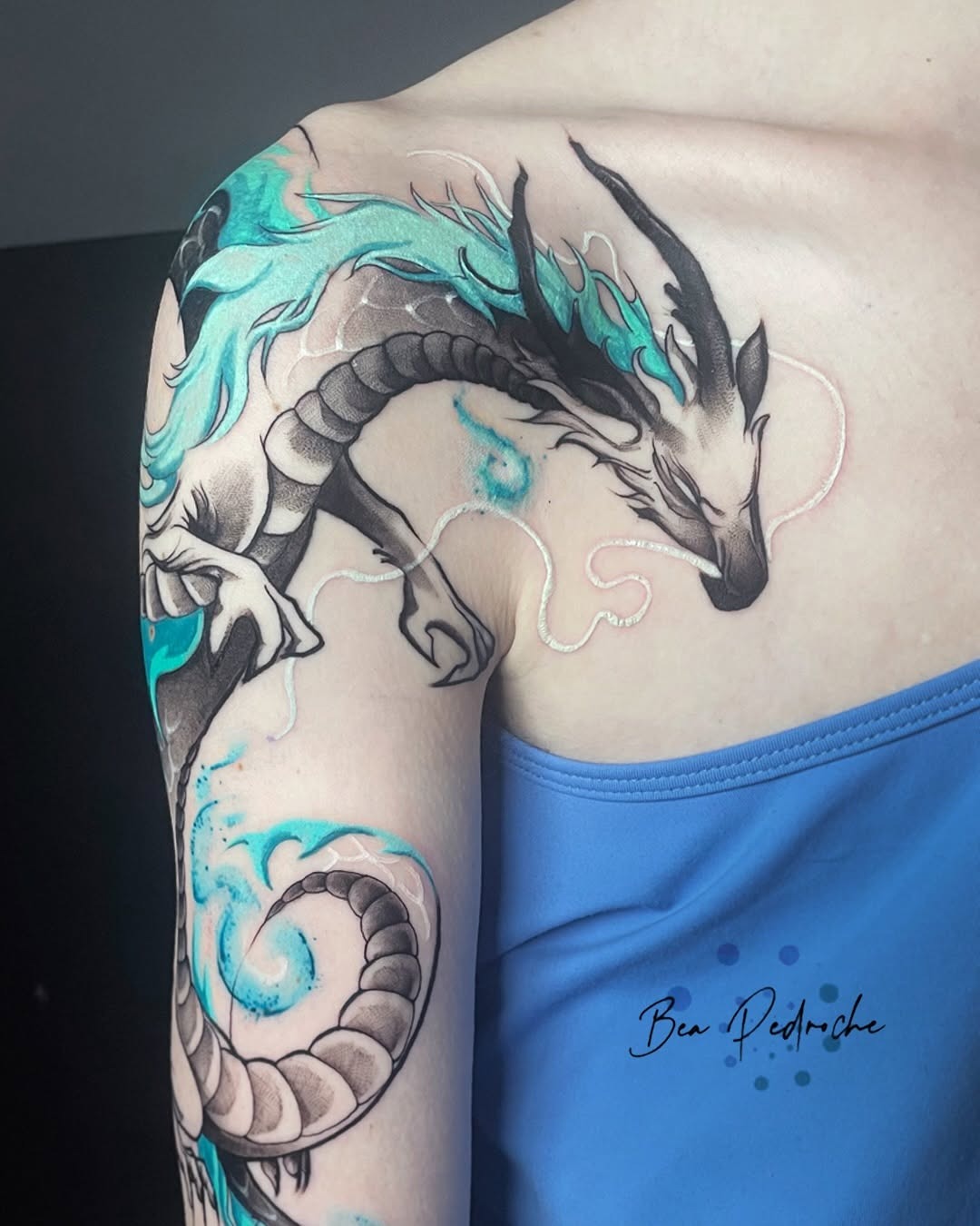 Stunning dragon tattoo with aqua accents Tattoo Design