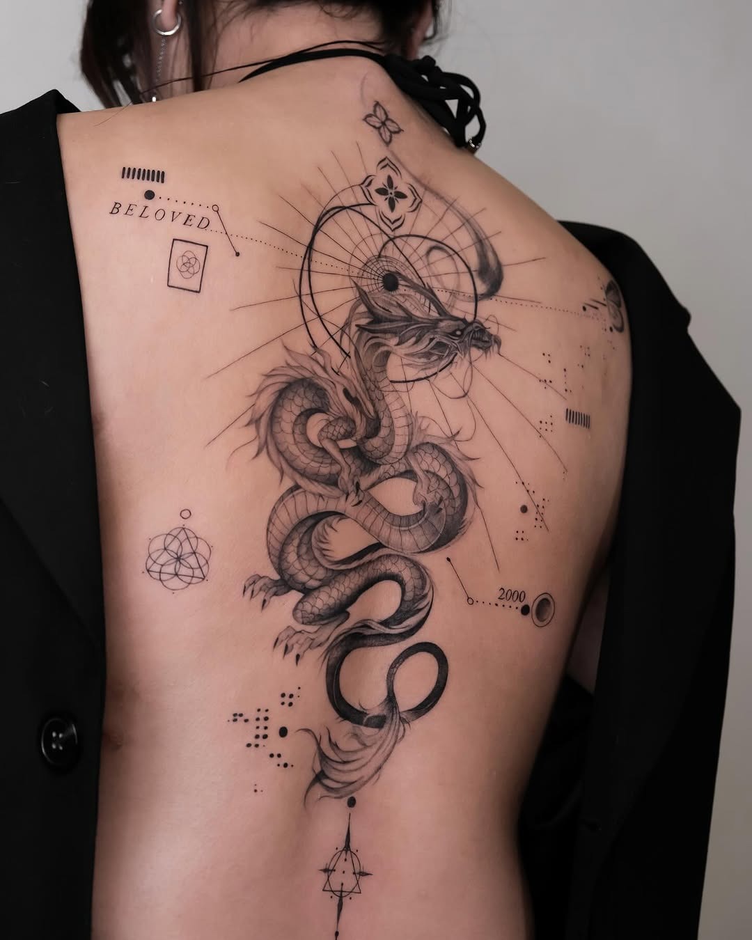 Stunning intricate dragon tattoo on the back Tattoo Design