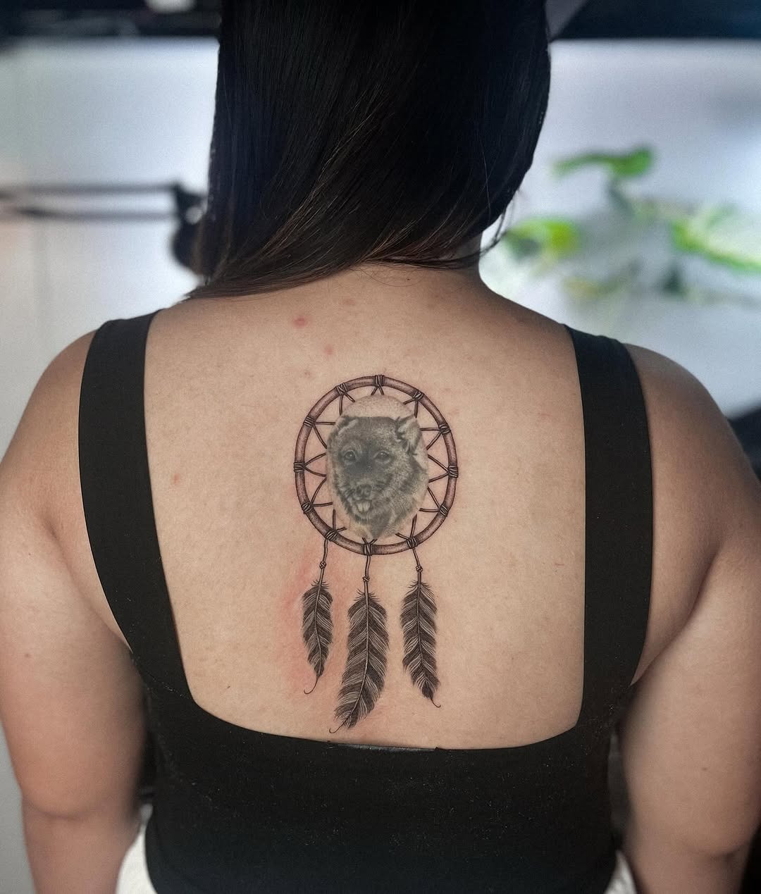 A stunning dreamcatcher with wolf symbolism Tattoo Design