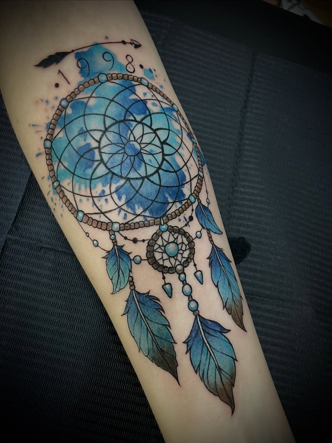 Dynamic Blue Dreamcatcher Tattoo with Feathers Tattoo Design
