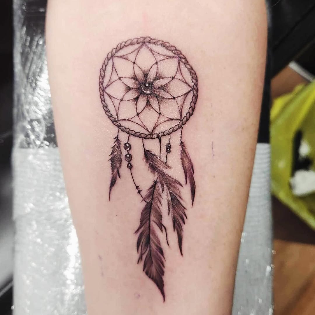 Elegant dreamcatcher tattoo with detailed feathers Tattoo Design