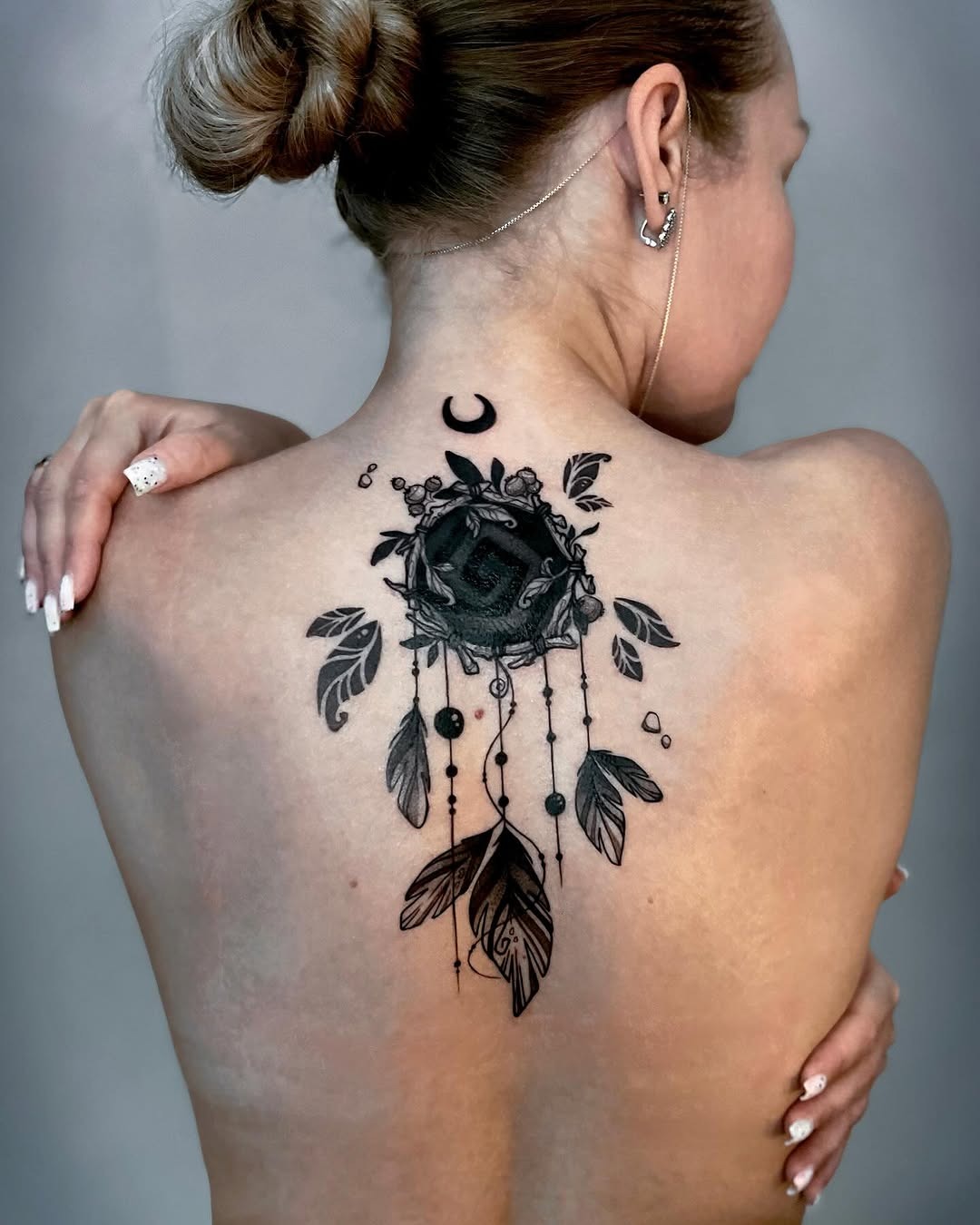 Stylish Dreamcatcher Tattoo with Floral Elements Tattoo Design