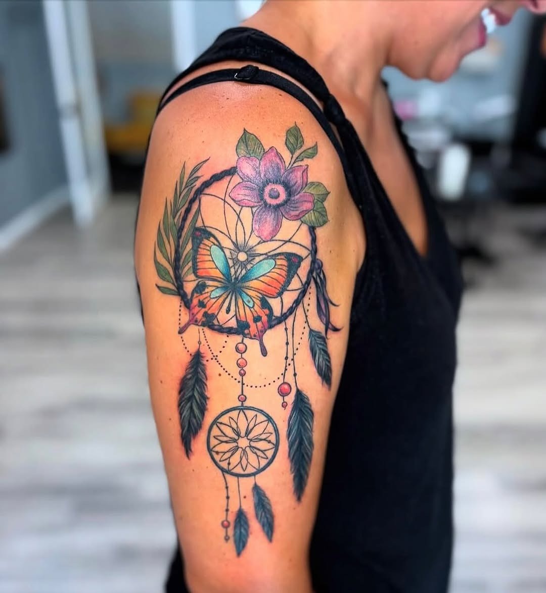 Vibrant dreamcatcher tattoo with butterfly and flowers Tattoo Design