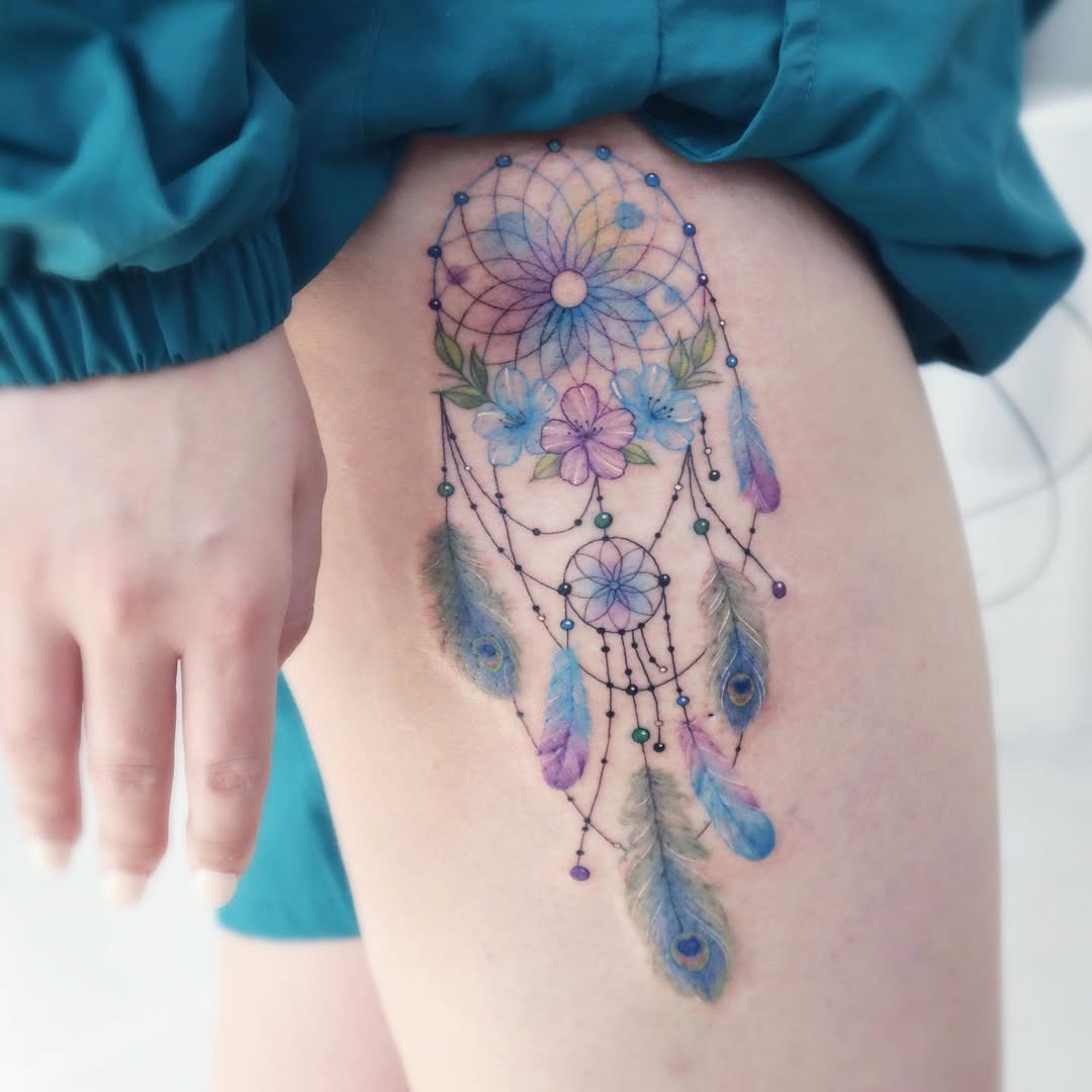 Vibrant Dreamcatcher Tattoo with Floral Elements Tattoo Design