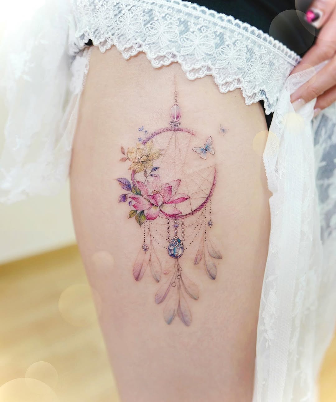 Vibrant Dreamcatcher Tattoo with Floral Elements Tattoo Design