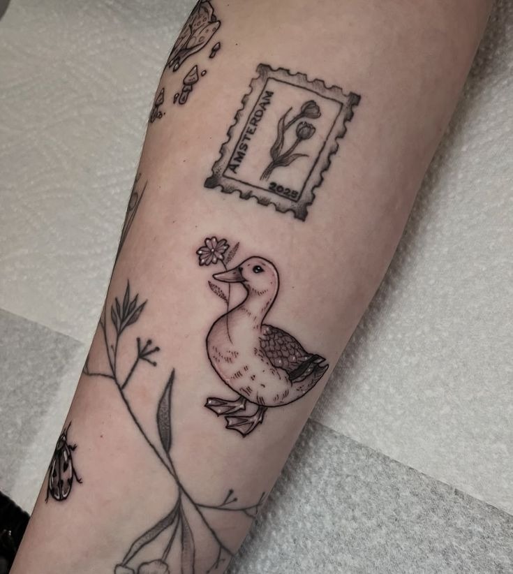 Tiny Fine Line Duck with Flower Tattoo Design