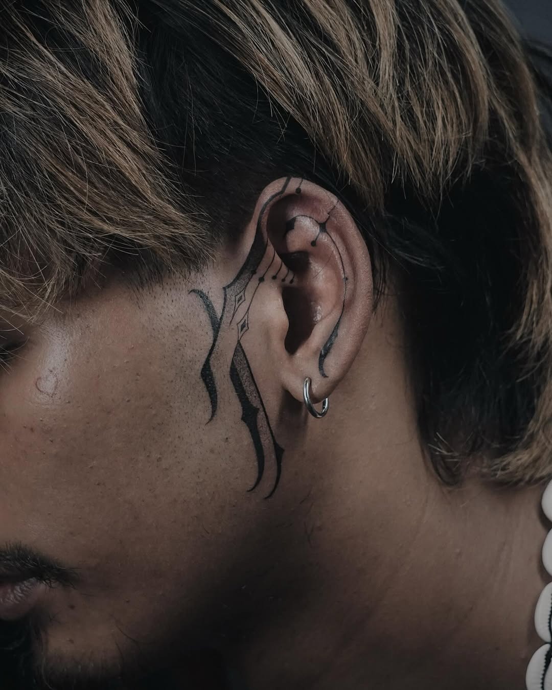 Bold Lines and Unique Ear Tattoo Styles Tattoo Design