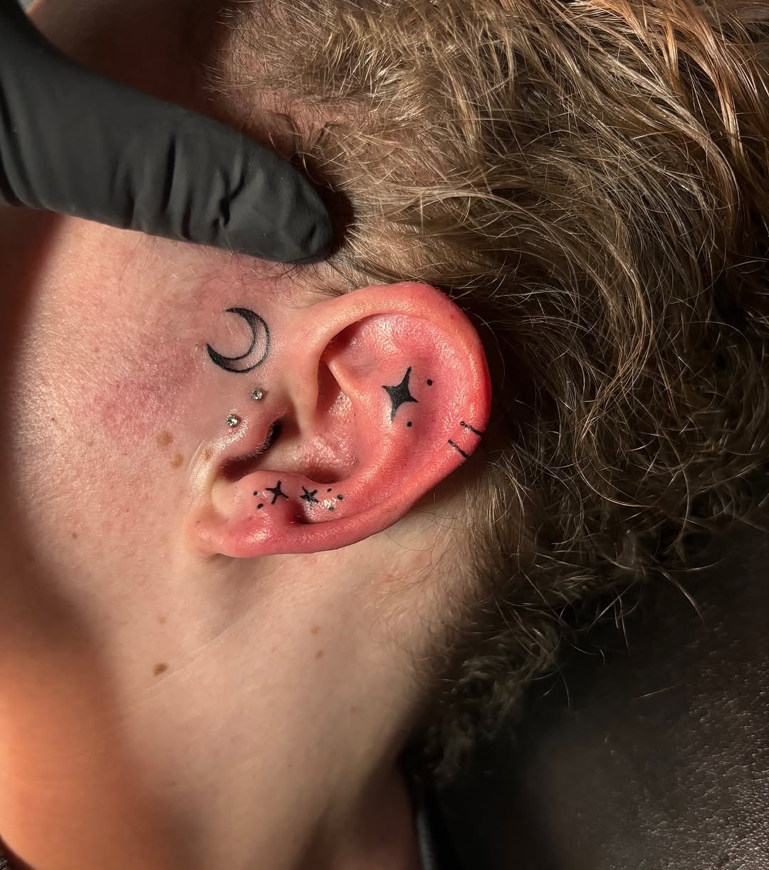 Chic ear tattoos with celestial themes Tattoo Design