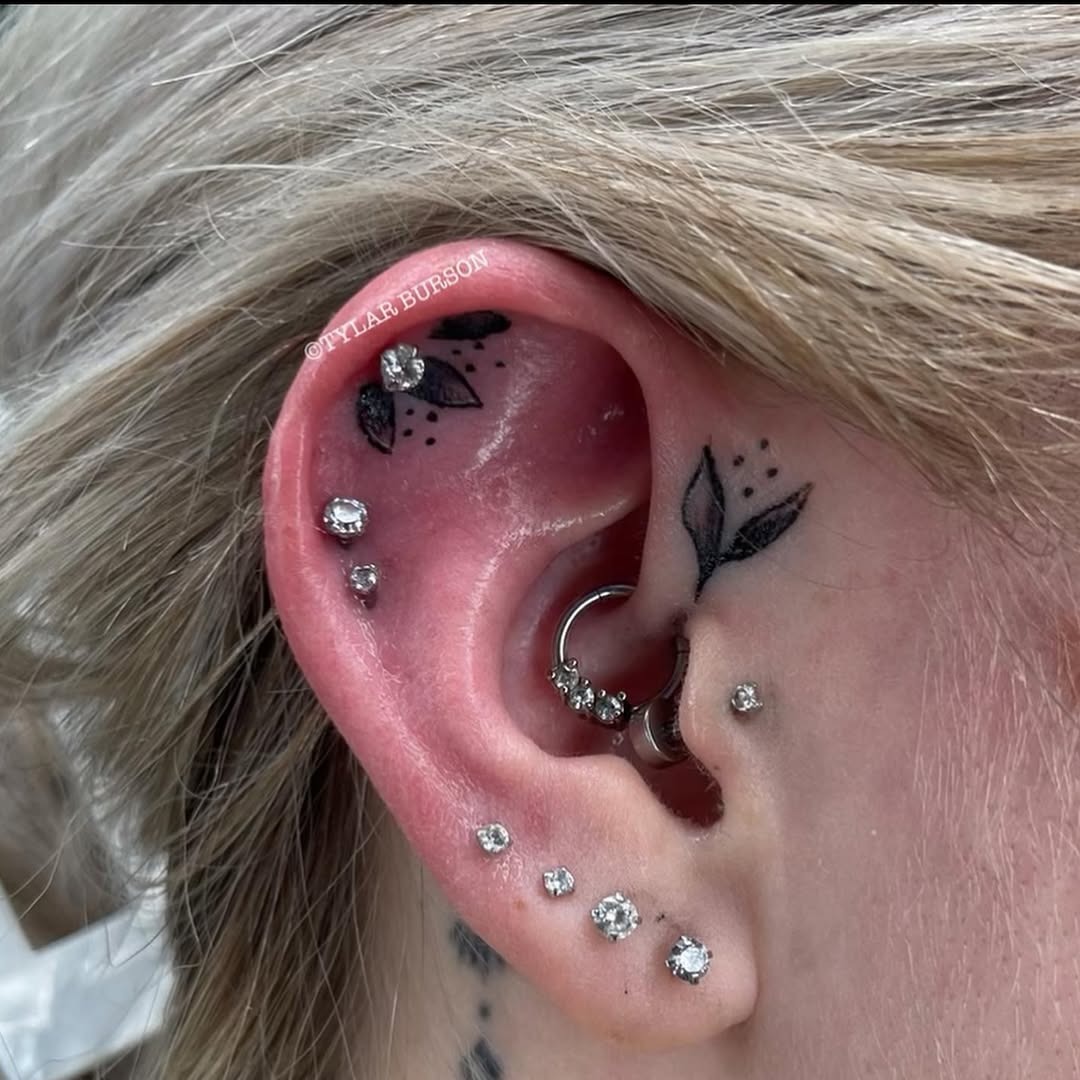 Delicate floral ear tattoos with sparkling accents Tattoo Design