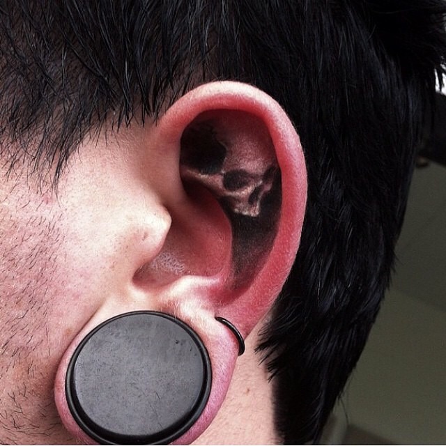 Edgy Skull Tattoo Inside Ear Tattoo Design