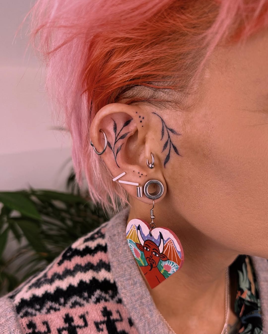 Elegant ear tattoos with floral designs Tattoo Design