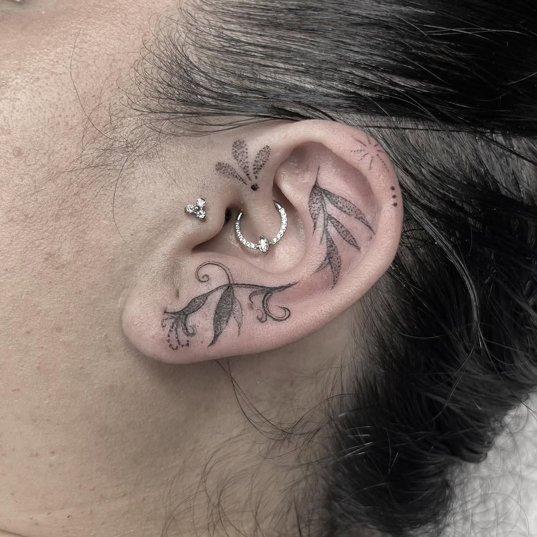 Elegant floral ear tattoo with intricate details Tattoo Design