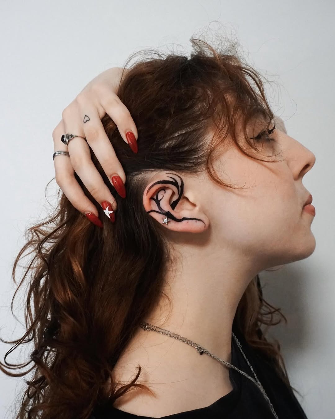 Minimalist ear tattoo for subtle elegance Tattoo Design