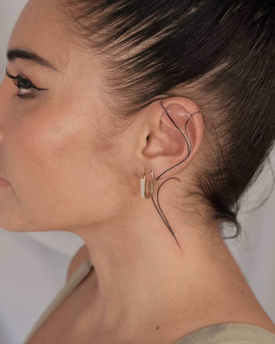 Sleek and stylish ear tattoo design Tattoo Design